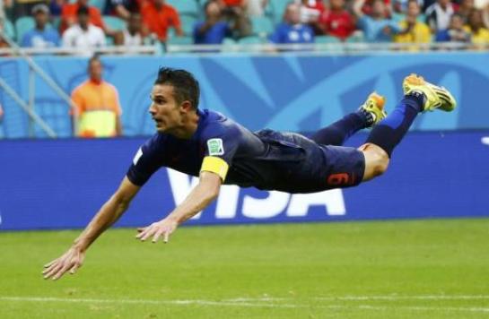 Robin van Persie of the Netherlands heads to score against Spain during their 2014 World Cup Group B soccer match. PHOTO: Reuters [Express Tribune Blogs]