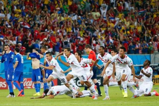 Costa Rica players celebrate their penalty shootout win. Photo: Reuters